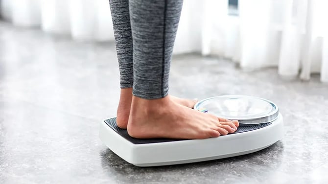 woman-scale-bathroom-weight-1296x728-header-1296x728